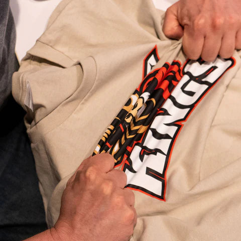 Garment with DTF printing being stretched to show durability